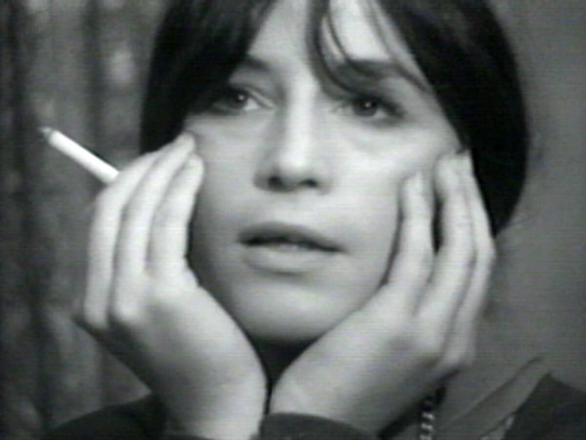 Carel smoking a cigarette during filming. 